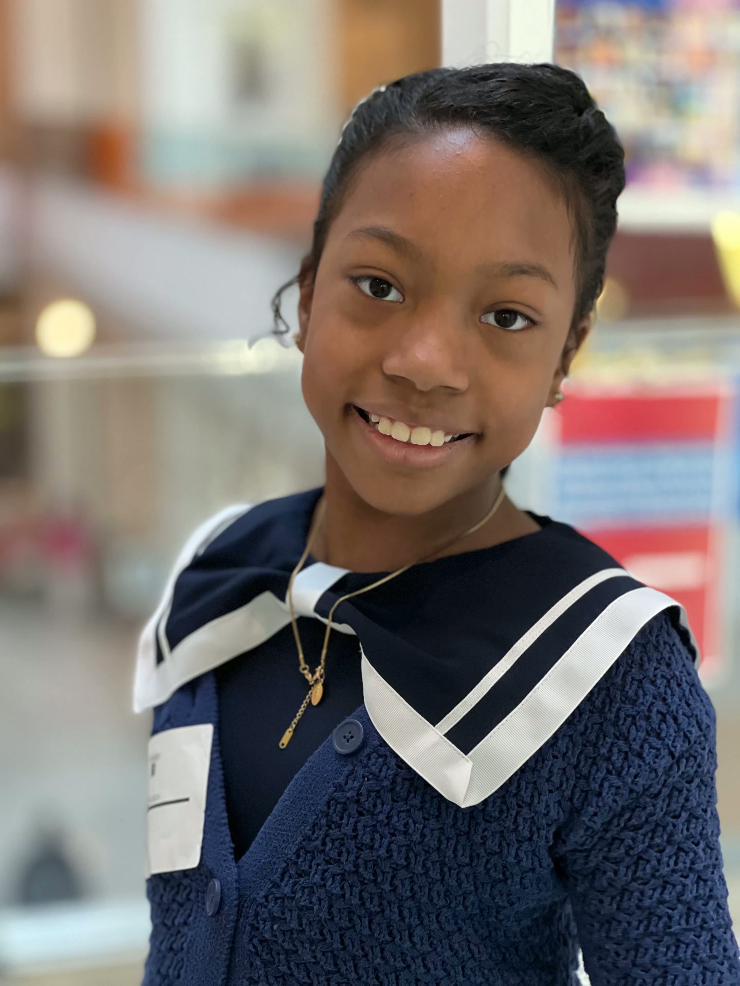 Ishara smiling in a navy outfit