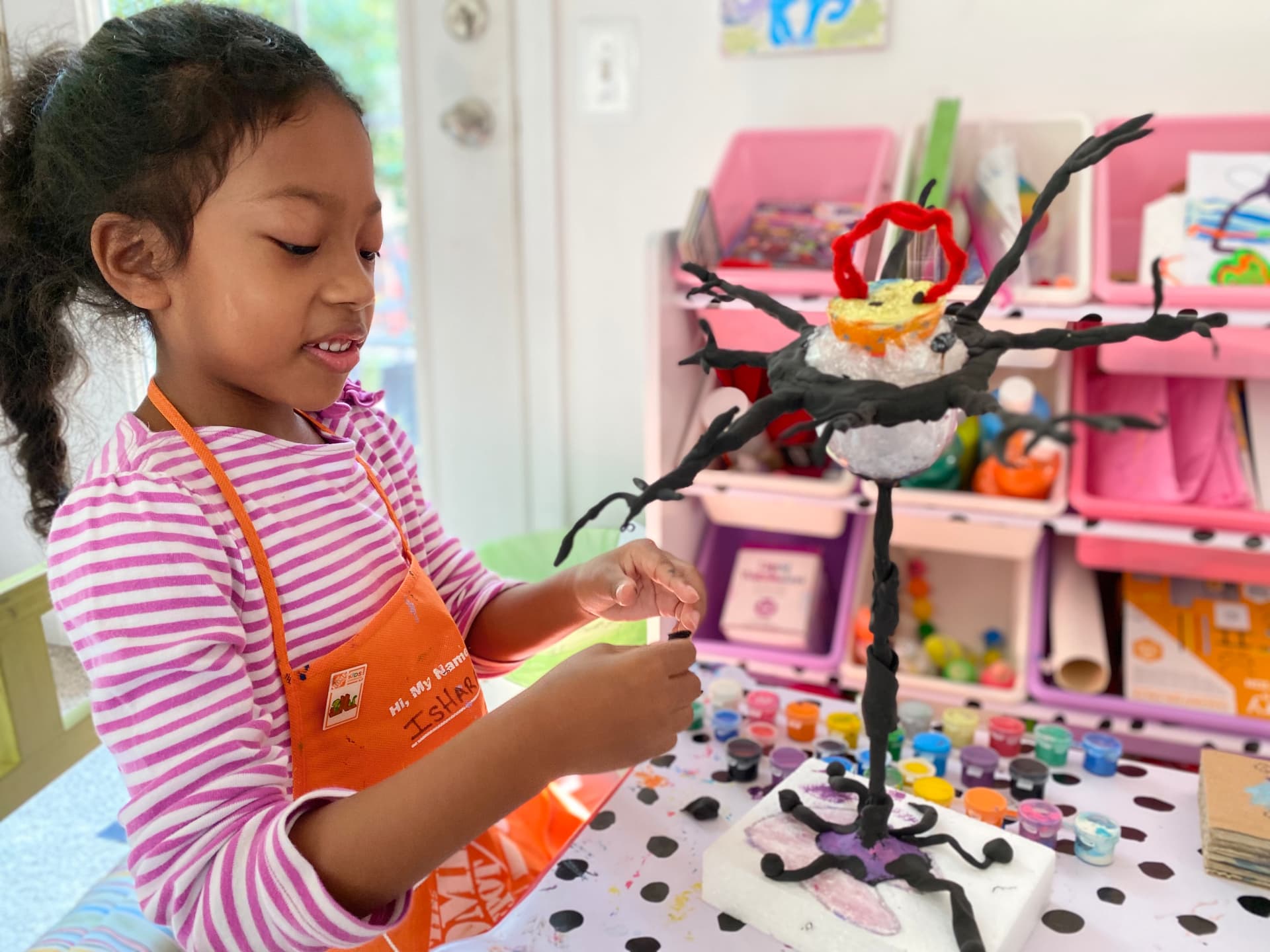 Ishara building a clay science model
